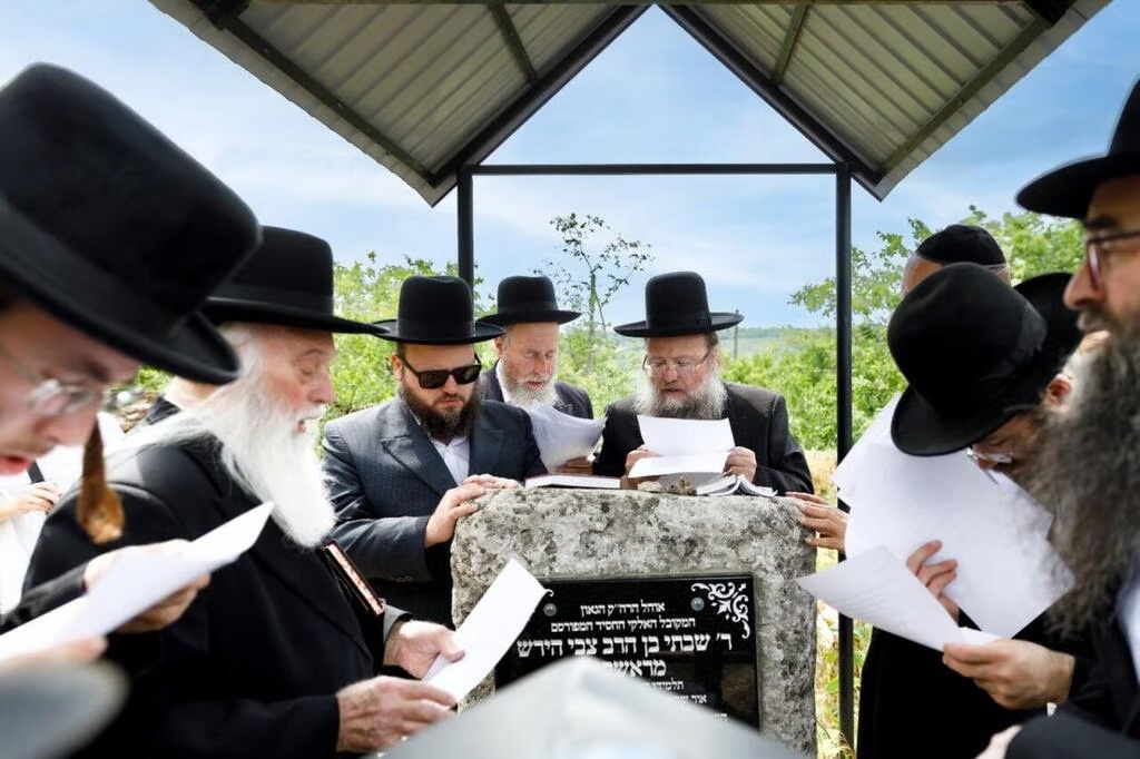 Pilgrims from Israel pray at the grave of Rabbi Shabtai